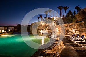 Long exposure shot of swimming pool at luxury night illumination