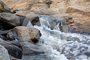 Long exposure shot of a water flowing between the rocks 2020