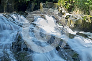 Long exposure shot of the water flows through the rocks