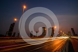 Long exposure shutter speed of car moving in road