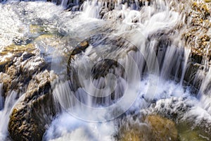 long exposure in a small waterfall in a mountain river of fresh and pure waters