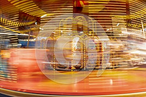 Long exposure of a spinning carousel ride