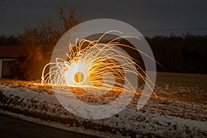 Long exposure of steel wool sparks in a field