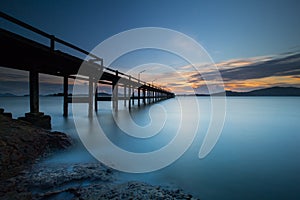long exposure Sunset background and wooden bridge