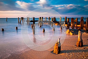 Long exposure at sunset of pier pilings in the Delaware Bay at S