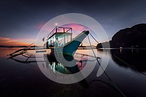 Long exposure with traditional Philippines boat at evening. Blue hour seascape