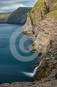 Bosdalafossur waterfall vertical composition long exposure, Faroe Islands