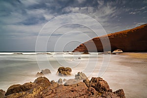 long exposure view of the beach and rock arch at Legzira on the Atlantic Coast of Morroco