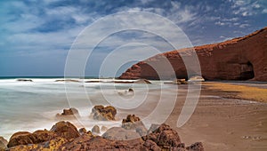 long exposure view of the beach and rock arch at Legzira on the Atlantic Coast of Morroco
