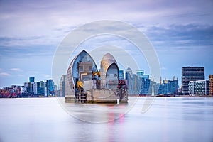 Long exposure view of Canary Wharf and Thames barrier in London