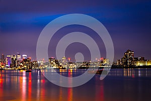 Long exposure view of Canary Wharf and Thames barrier in London