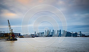 Long exposure view of Canary Wharf and Thames barrier in London