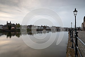 Long exposure view of the historic skyline of Maastricht with a view over the river Meuse and the old roman bridge