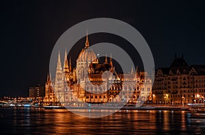 Long exposure view of Hungarian Paliament National Assembly by Danube river in the evening