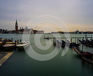 A Long Exposure view of moving Gondolas with Landscape in Venice, Italy