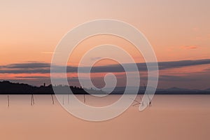 Long exposure view of Trasimeno lake Umbria, Italy at sunset,