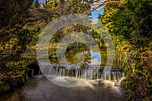 A long exposure view of a weir at Newstead Park, Nottinghamshire, UK photo