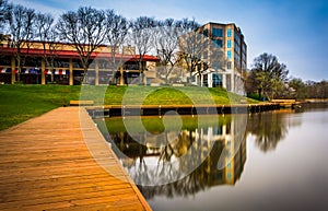 Long exposure of a walkway and buildings along the shore of Lake