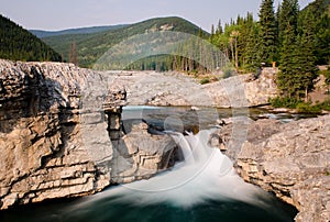 Long exposure of the water flowing down of the pictureque Elbow Falls in Alberta, Canada