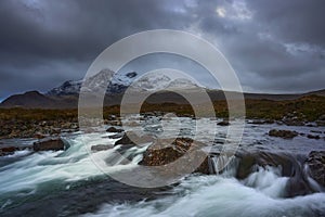 Long exposure of water over rocks and small waterfall on the River Sligachan on the Isle of Skye Scotland with the Cuillin