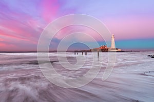 Long exposure of waves on the beach at St.Mary`s Lighthouse photo