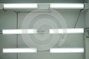 Long fluorescent lamp Installed on the concrete ceiling In the industrial factory