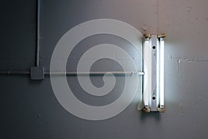 Long fluorescent lamp Installed on the concrete ceiling In the industrial factory