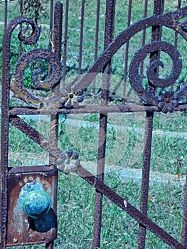 Long forgotten ornate cemetary gate