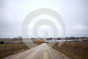 Long freight train crossing a remote rural road