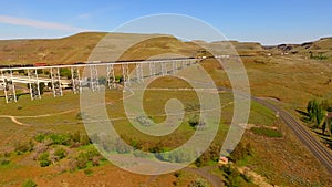 Long freight train travels railroad Trestle Bridge Lyons Ferry