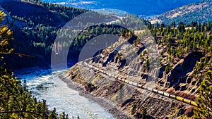 Long Freight Trains following the Thompson and Fraser Rivers along steep Cliffs and through Tunnels in the Fraser Canyon