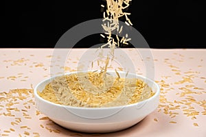 Long grain parboiled basmati rice pouring into the plate