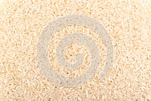 Long grain rice as background. Rice texture