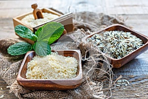 Long-grain rice in a bowl and a wooden box.