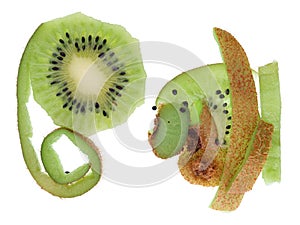 Long green an haired brown skins from peeled ripe kiwi apteryx fruit isolated