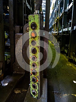 Long green metal industrial lift pedent control box