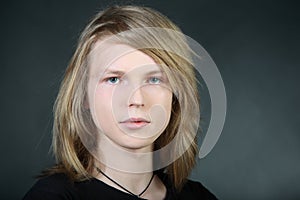 Long hair boy in photo studio