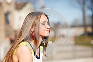 Long hair girl`s portrait outdoor