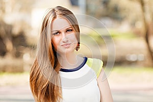 Long hair girl`s portrait outdoor