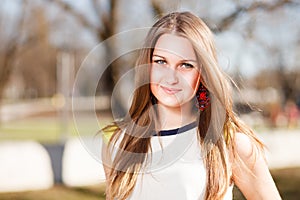 Long hair girl`s portrait outdoor