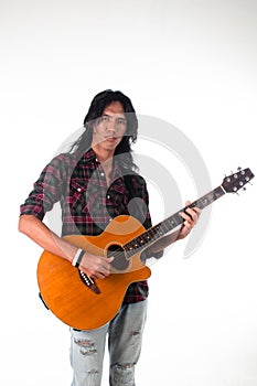 Long hair guy playing guitar acoustic