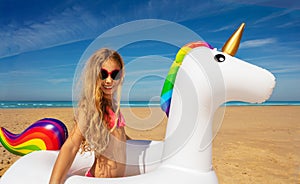 Long hair happy blond girl have fun win unicorn