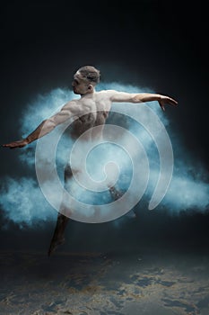 Long hair muscle man dancer in dust. Prostate cancer concept