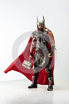 Man in cosplaying Thor isolated on white studio background