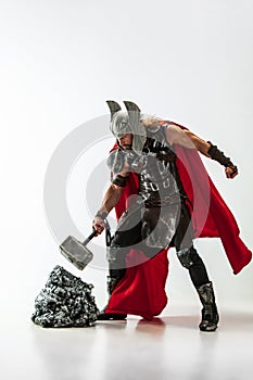 Man in cosplaying Thor isolated on white studio background photo