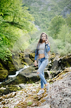 Long hair woman posing in mountains