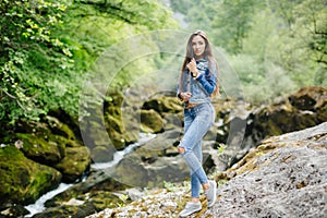 Long hair woman posing in mountains