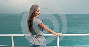 Long hair woman standing on the ferry boat deck