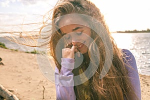 Long haired blonde outdoors wind