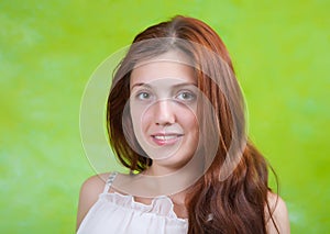 Long-haired girl over green